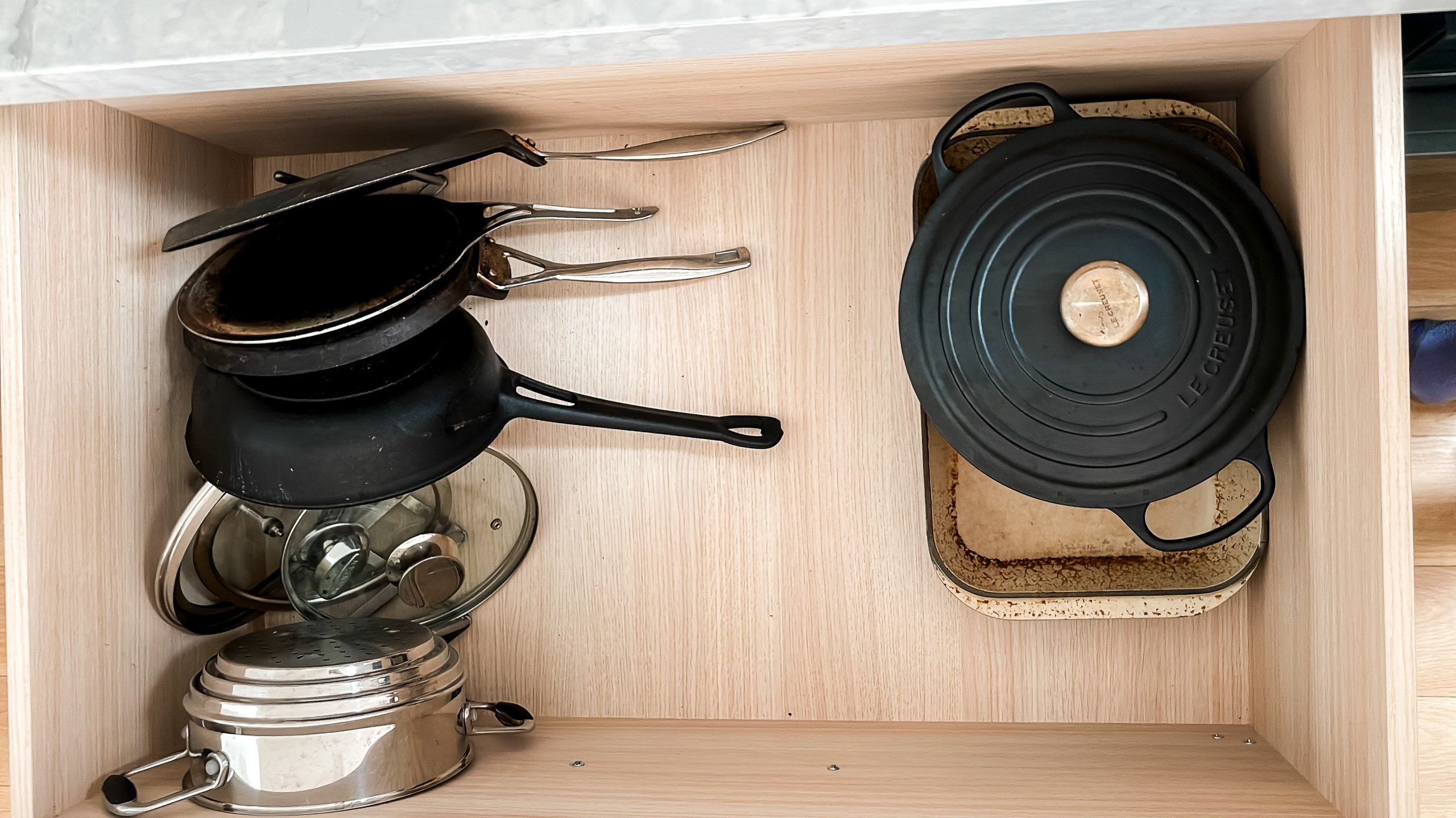 Organising pots & pans in a drawer in a small kitchen stacey clare