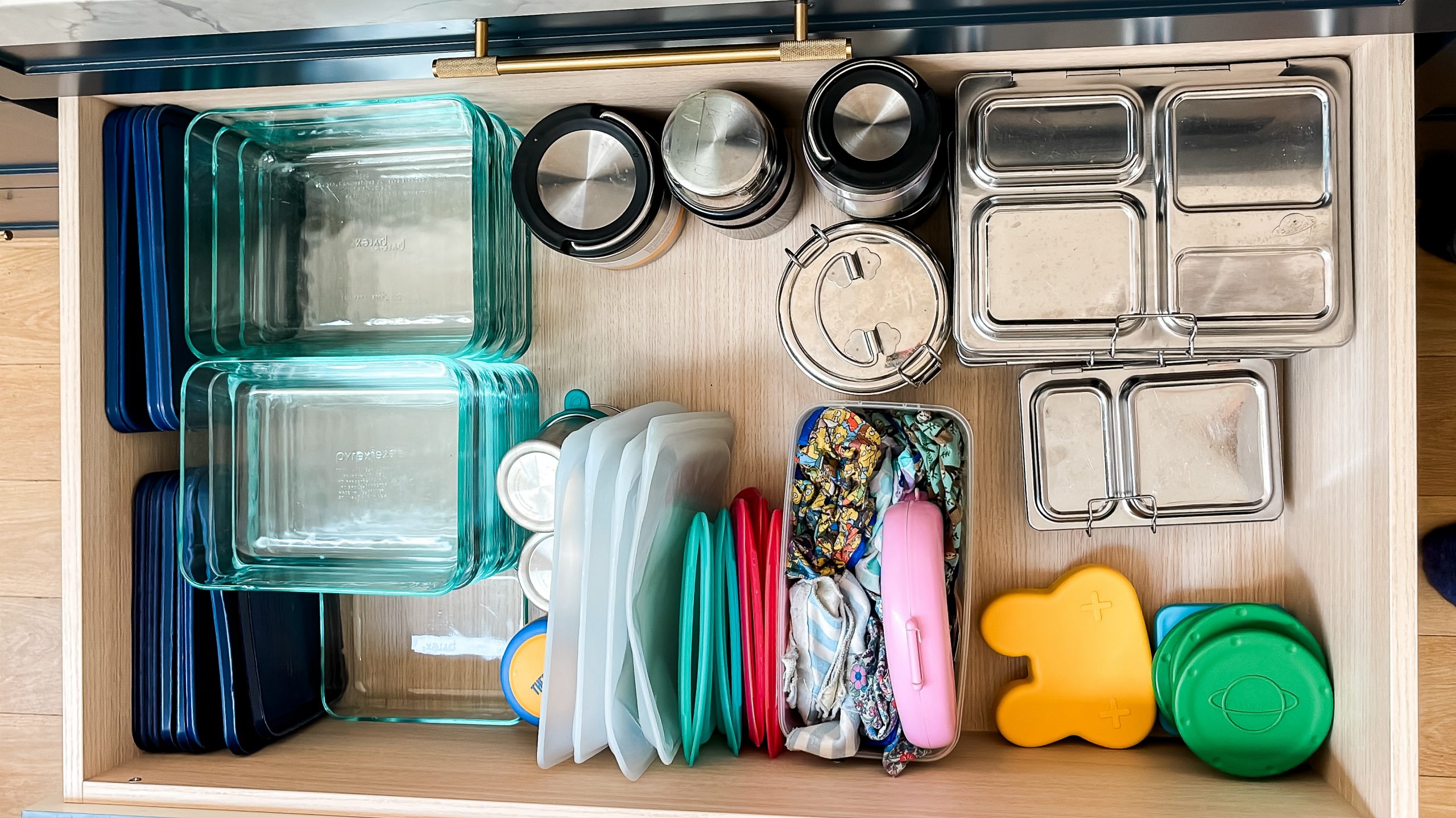 Organising Tupperware and lunchbox drawer in a small kitchen stacey clare